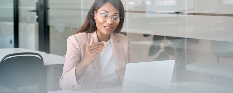 Female executive presenting online